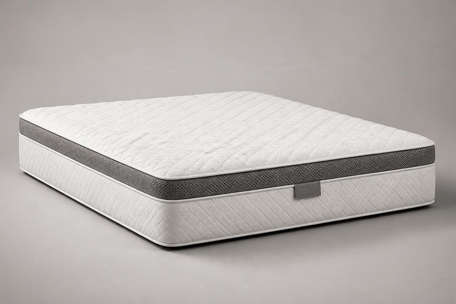 Studio packshot of a quilted off white mattress with a dark grey mesh side panel on a pale grey backdrop